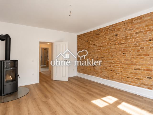 Stilvoll sanierte 3 Zimmer Wohnung mit Kaminofen, Sichtziegelwänden & hochwertigem Bad