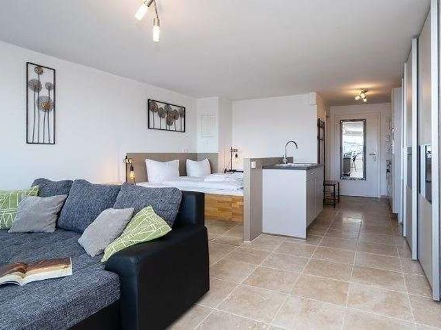 Strandnahe, LUXUS 1 Zimmer Wohnung mit WEST LOGGIA, Keller u. TG Stellplatz