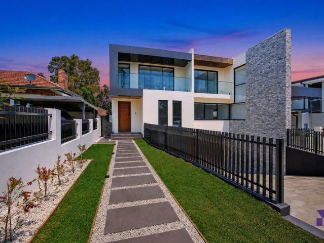 Striking contemporary duplex designed for spacious modern living with basement parking