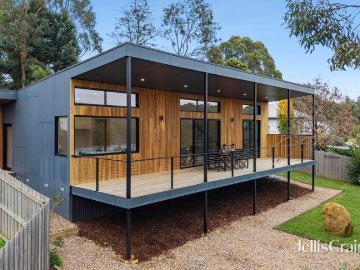 Striking contemporary living with light filled spaces and gully views