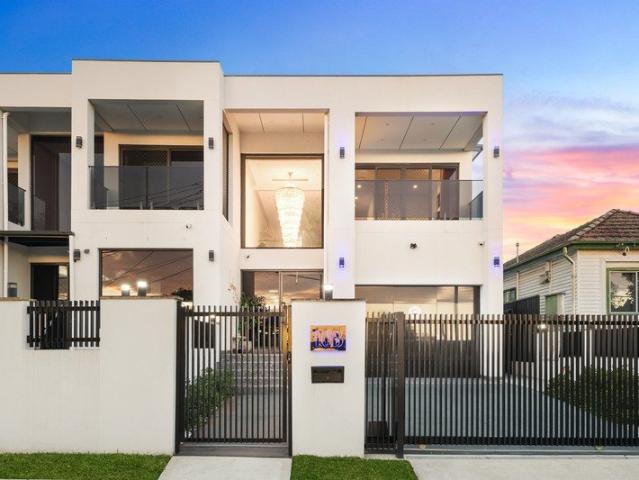 Striking Full Brick Duplex Blends Space and Style in Highly Prized Setting
