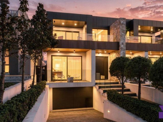 Striking home delivers state of the art living/entertaining with pool and basement parking