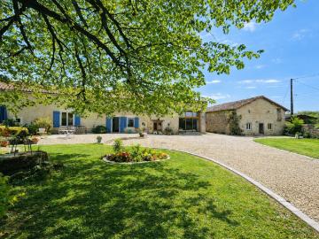 Stunning 4 bedroom detached house with barns, gîte to convert, and low maintenance garden