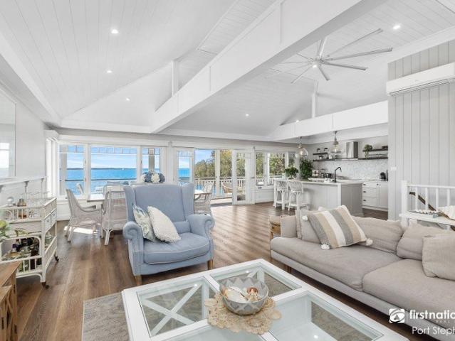 STUNNING WATERFRONT RESERVE LIVING WITH TIMELESS COASTAL CHARM