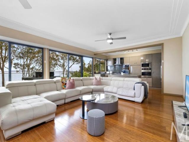 Stunning Absolute Waterfront Home With Panoramic Lake Views