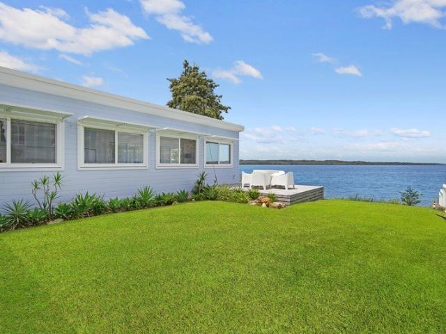 STUNNING ABSOLUTE WATERFRONT !