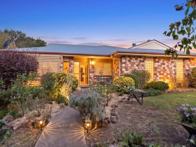 Stunning and spacious brick home with established gardens in beautiful Allora!