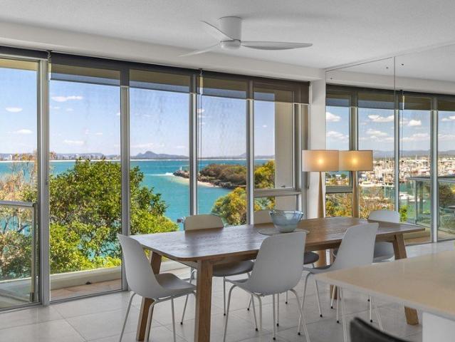 STUNNING APARTMENT AT THE TIP OF POINT CARTWRIGHT SWEEPING WATER RIVER AND OCEAN VIEWS