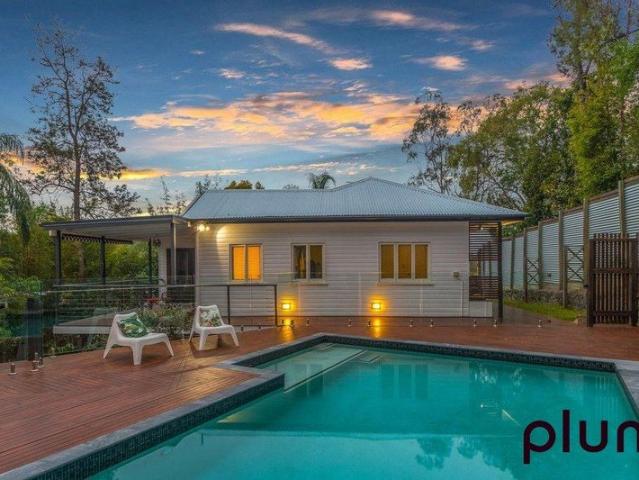Stunning Bardon home with pool, solar, air conditioning and leafy outlook!
