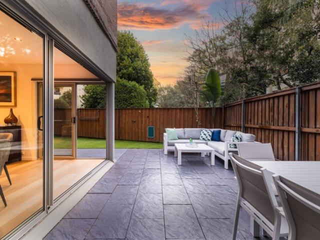 Stunning contemporary split level apartment with wraparound garden courtyard