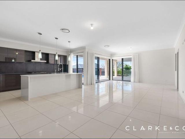 STUNNING FAMILY HOME WITH RESORT STYLE POOL IN ABERGLASSLYN!