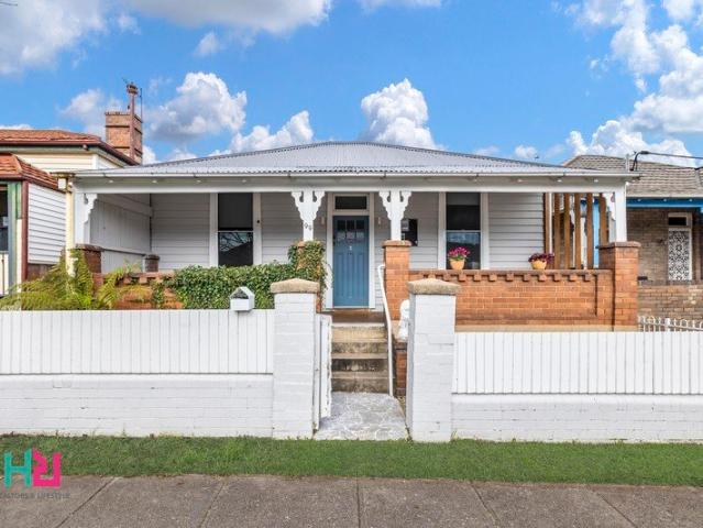 Stunning Fully Renovated Home with Rear Lane Access & Exceptional Style