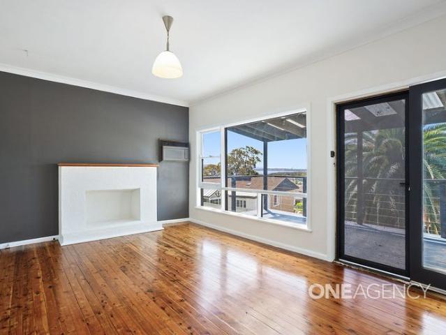 STUNNING LAKE VIEWS AND LIGHT FILLED LIVING