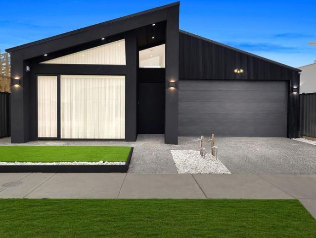 Stunning Modern 4 Bedroom Home with High End Finishes and Raked Ceilings!