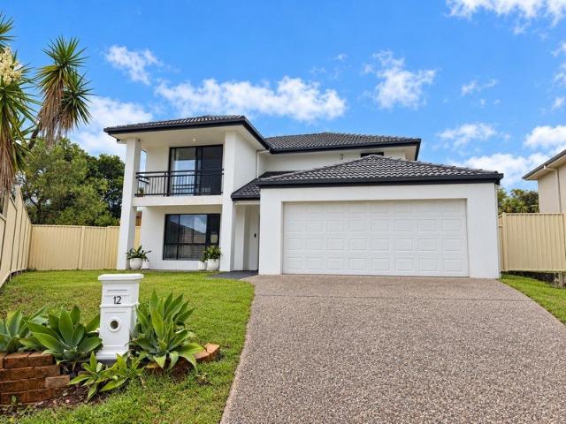 STUNNING RENOVATED FAMILY HOME WITH WATER & HINTERLAND VIEWS MOVE IN READY & PRICED TO SELL!