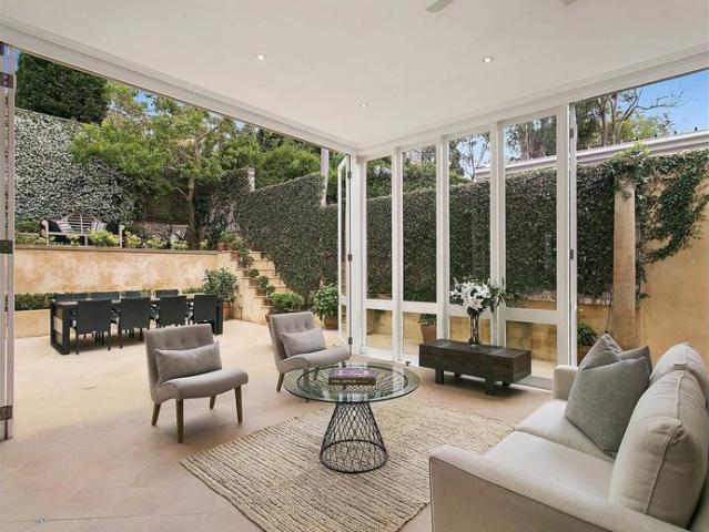 Stunning Sandstone Character Home with Soaring Ceilings & Courtyard