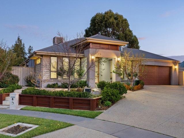 STYLE, FUNCTIONALITY & FAMILY SPACE IN PEACEFUL COURT SETTING