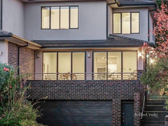 Three level internal lift access from double garage, in serene setting