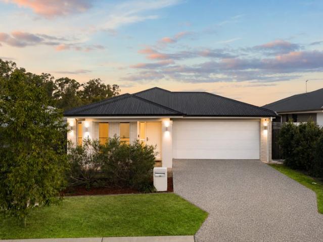 Stylish Metricon Home with Ducted Comfort, High Ceilings & 6.6kW Solar on 456m².