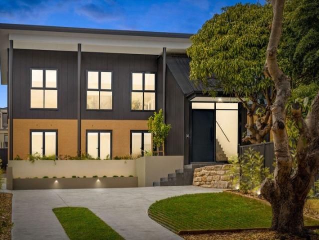 Stylish Modern Duplex with Landscaped Backyard