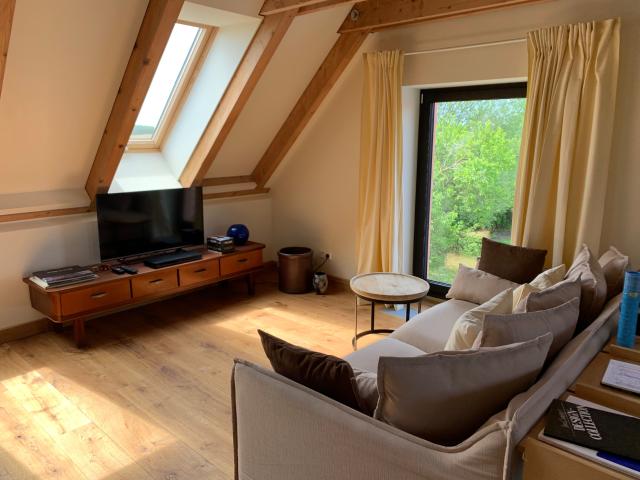 Stylish and cosy loft apartment with direct connection to our lounge and the park garden