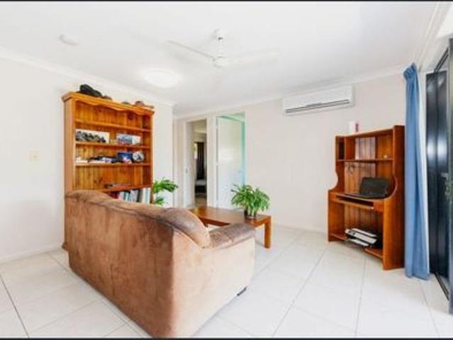 Stylish Coastal Retreat – Four Bedroom Home with Multiple Living Areas & Solar in Beautiful Bushland Beach!
