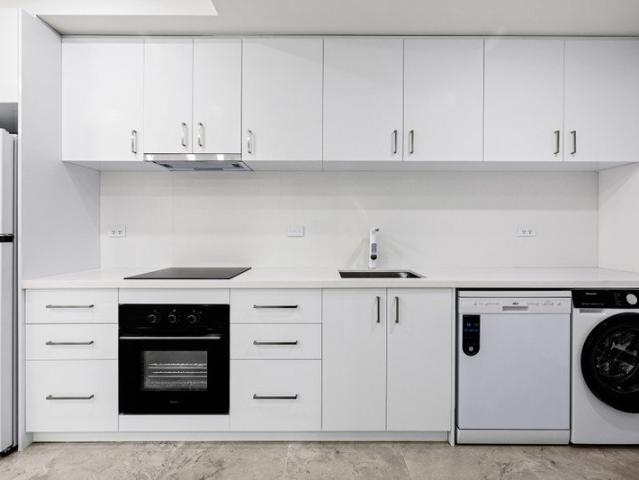 Stylish Fully Renovated Apartment Moments from Box Hill Central