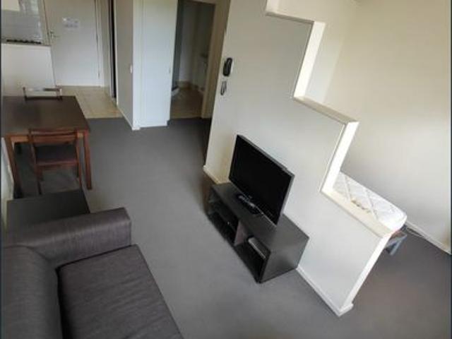 Stylish Furnished Apartment with Pool View – Walk to Uni & Lygon Street