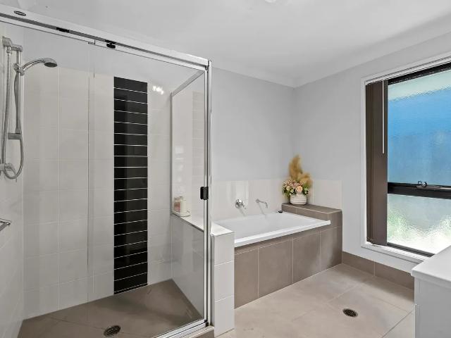 Stylish Family Oasis Hallmark Home with Versatile Floorplan Walk to Schools & Shops!