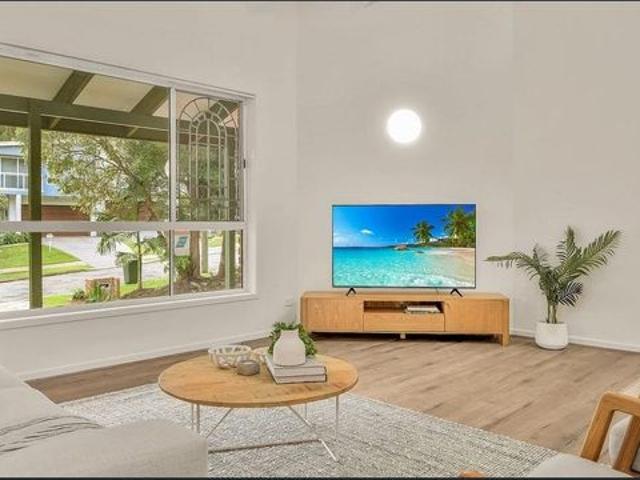 Stylish four bedroom plus home, steps from Flynns Beach