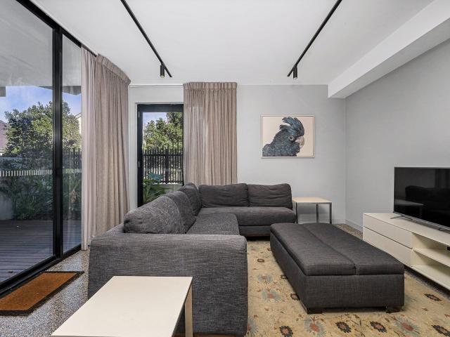 Stylish Ground Floor Apartment with Dual Courtyards & Private Access