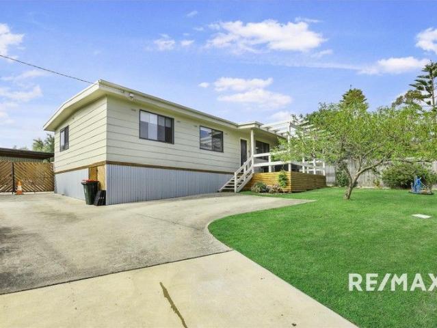Move In Ready Coastal Home with Strong Investment Appeal & Large Backyard