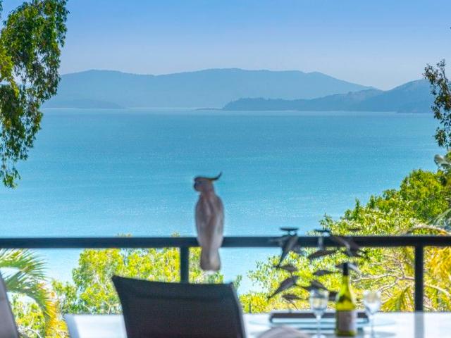 Stylish Island Retreat With Ocean Views & Rare Full Garage
