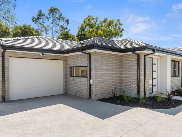 Stylish, Low Maintenance Living in Walk to Town Location