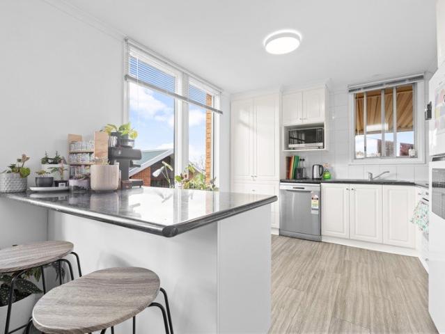 Stylish, Low Maintenance Living With An Investment Already in Place!