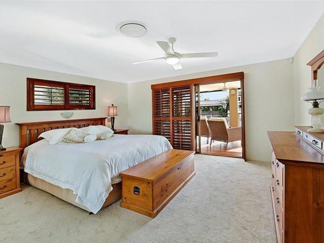 Stylish Paradise Waters Single Level Entertainer Wide Waterfront Home!