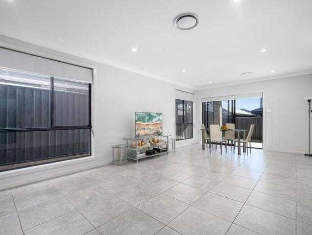Stylish & Spacious 4 5 Bedroom Home Featuring Ducted Air Conditioning & Lock Up Garage