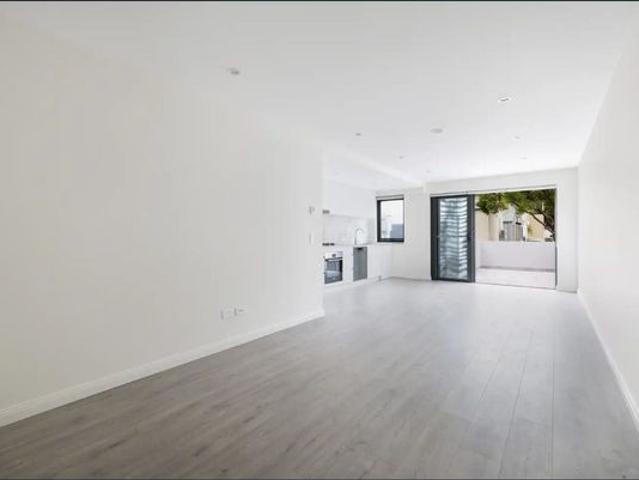 Stylish Split Level Apartment with Private North Facing Courtyard