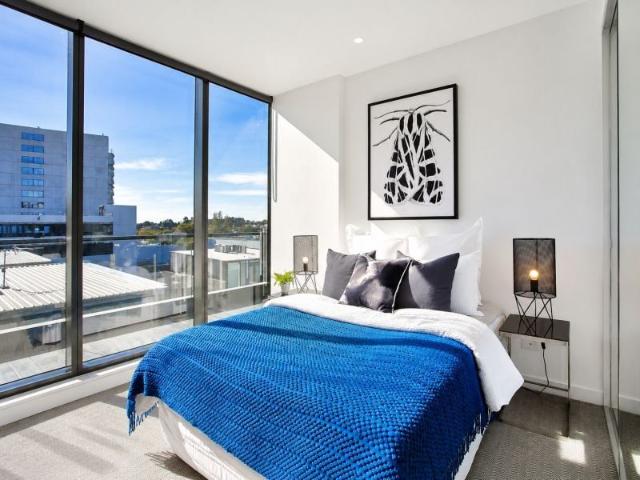 Stylish Two Bedroom Apartment with Rooftop City Views