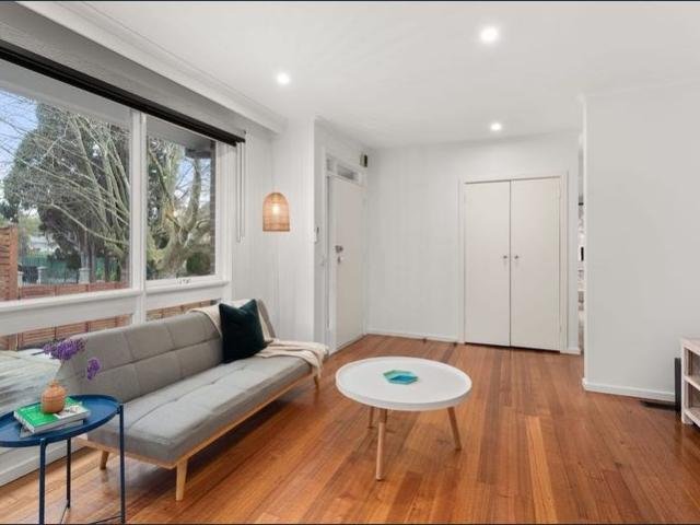 Stylish Two Bedroom Home with Spacious Deck and Prime Location