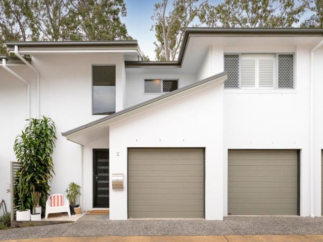 Stylish Townhouse Offering Two Outdoor Living Areas, High Ceilings, Designer Finishes & Absolute Serenity!