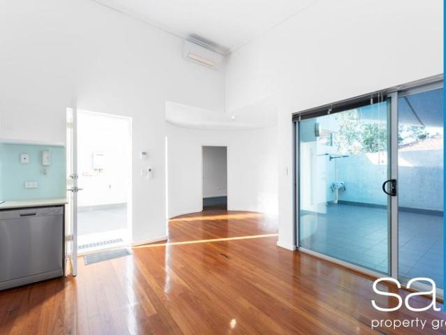 Stylish 1 Bedroom Apartment with 2 Car Bays & Spacious Courtyard