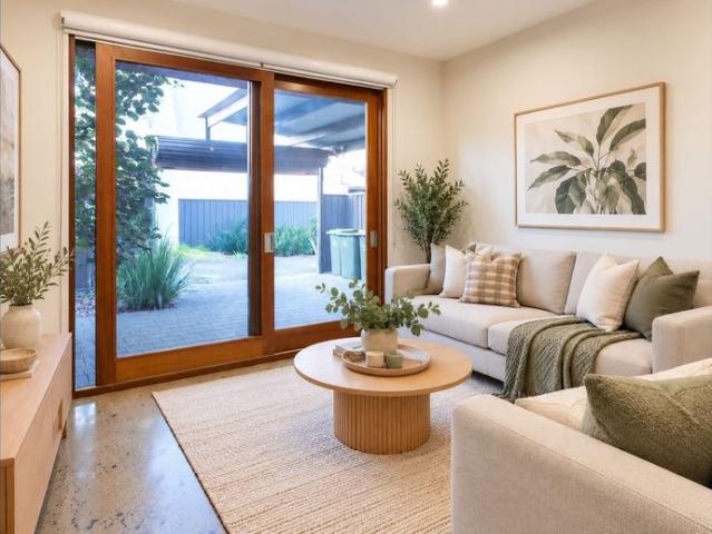 Stylish 3 Bedroom Townhouse with Secure Carport & Two Private Courtyards