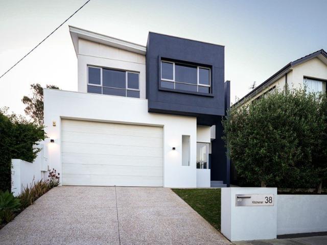 SUMMERS BY THE POOL + LUXURY LIVING IN A FUNCTIONAL FAMILY HOME ALL JUST MOMENTS FROM THE SAND AND EVERYTHING YOU NEED