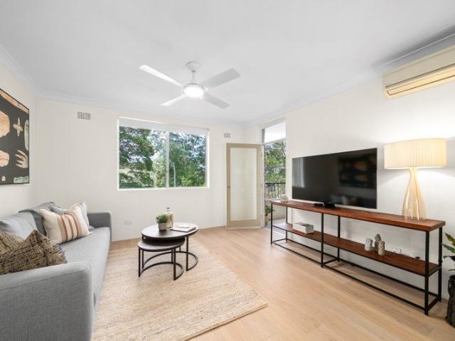 Sun drenched apartment with leafy outlook and double garage