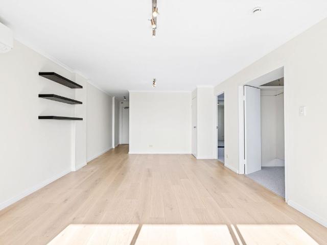 Sun Drenched Designer Apartment with City Views and Double Garage