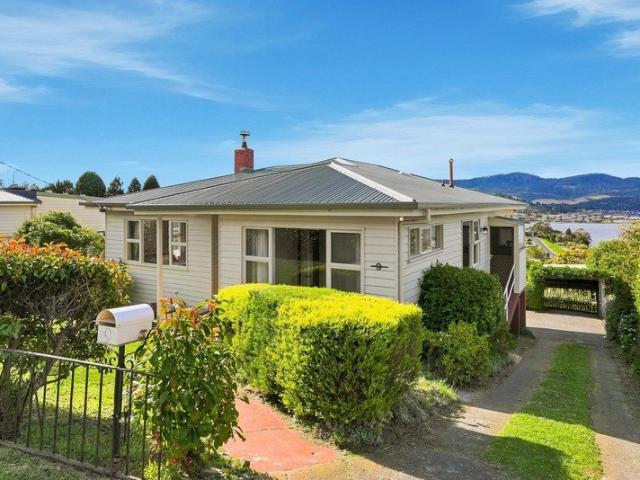 Sun drenched home with stunning water views, huge backyard Room for everyone!
