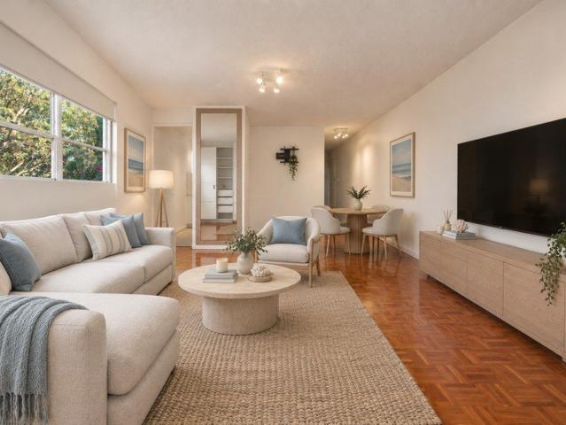 Sun Drenched North Facing Corner Apartment with Panoramic Views & Parking