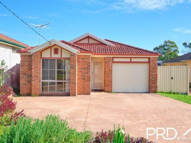 Single Level Brick Home with Double Garage & Expansive Fenced Backyard
