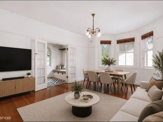 SUN FILLED TWO BEDROOM APARTMENT WITH SUNROOM